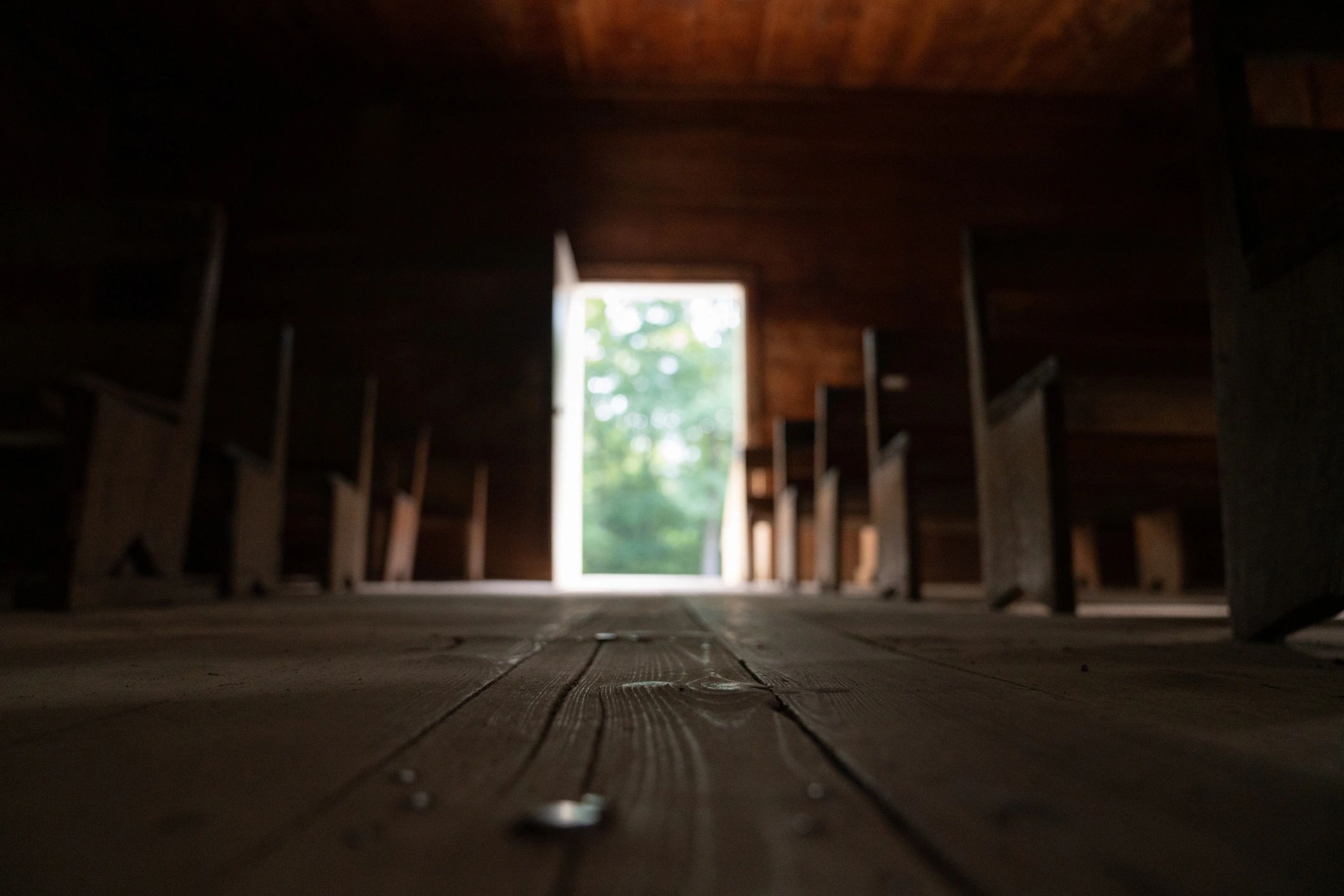 Church aisle with pews and natural light