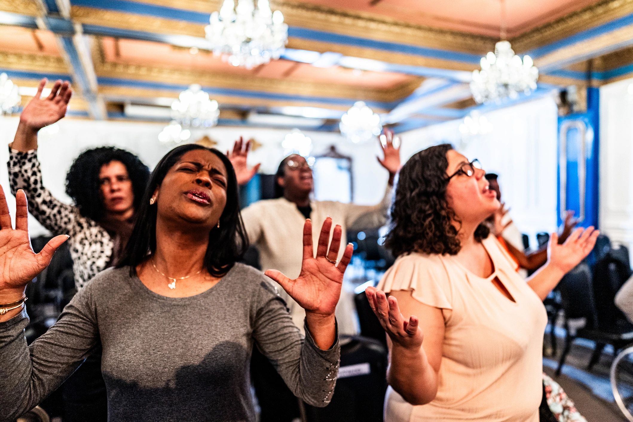 Woman worshipping during a church service